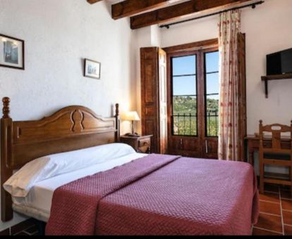 Una de las acogedoras habitaciones de estilo tradicional de este hotel rural.