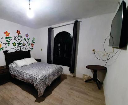 Foto de una de las habitaciones de este hotel solo para adultos.