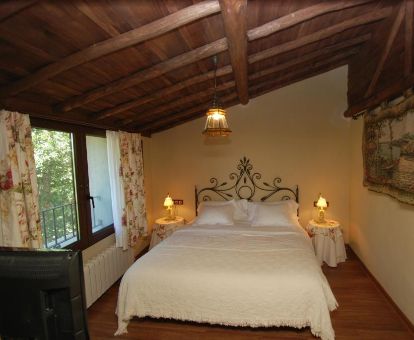 Una de las acogedoras habitaciones de este alojamiento rural.